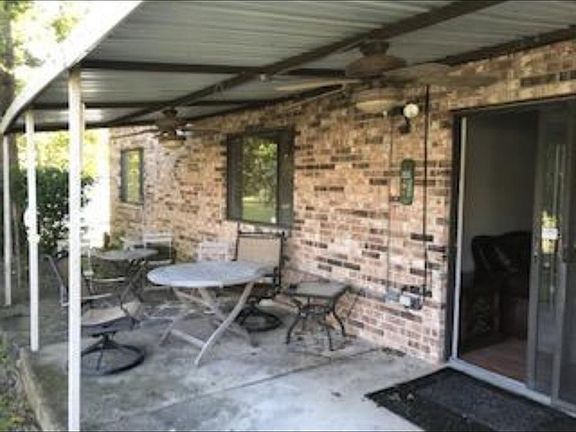 Covered back porch with partial lake views