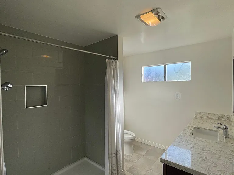 Bathroom 2 with full standing shower plus 6 ft wide countertop w/sink