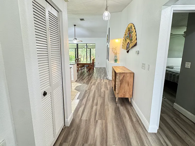 Foyer, to the right is the full bathroom connected with bedroom 2 & 3.