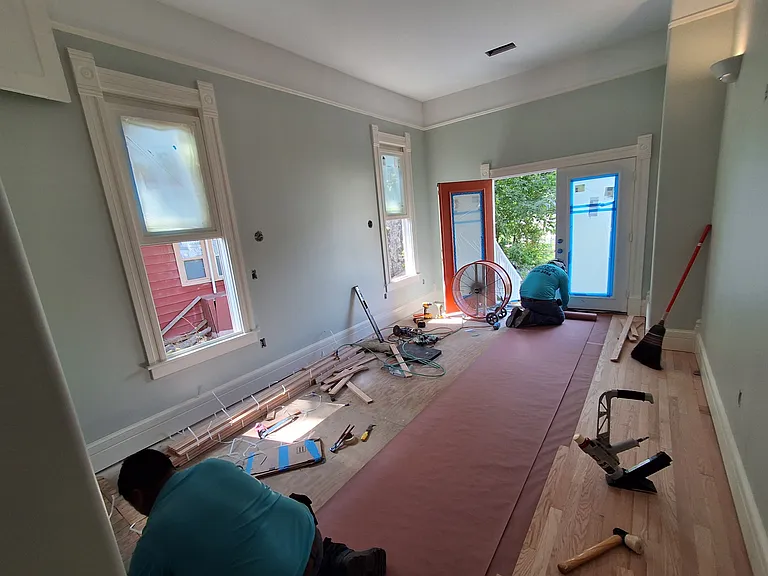 New solid real oak flooring being installed in master bedroom. July 22