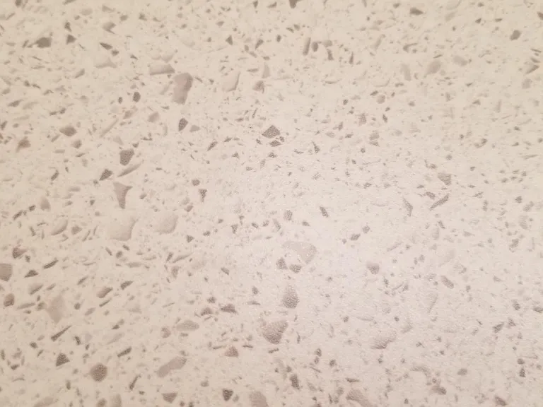 Countertop faux quartz pattern in kitchen and bathrooms