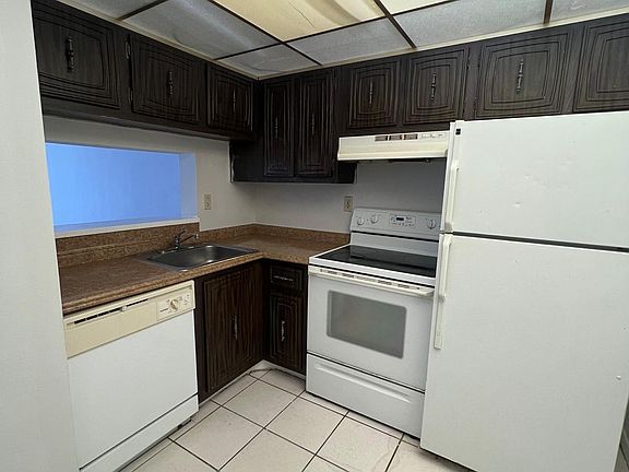Kitchen. Cabinets have been refinished to white