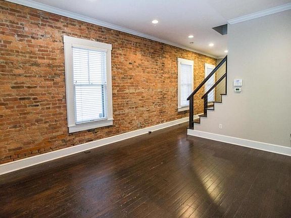 Exposed brick and original hardwood floors.