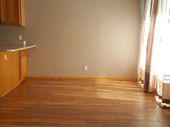 The living room continues the open concept to a dining area.