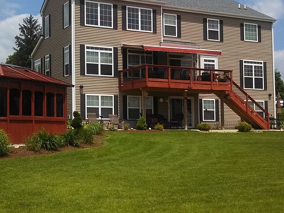 Back of House
						:
						Hot tub, large deck w/remote awning, patio into walkout basement, perenials