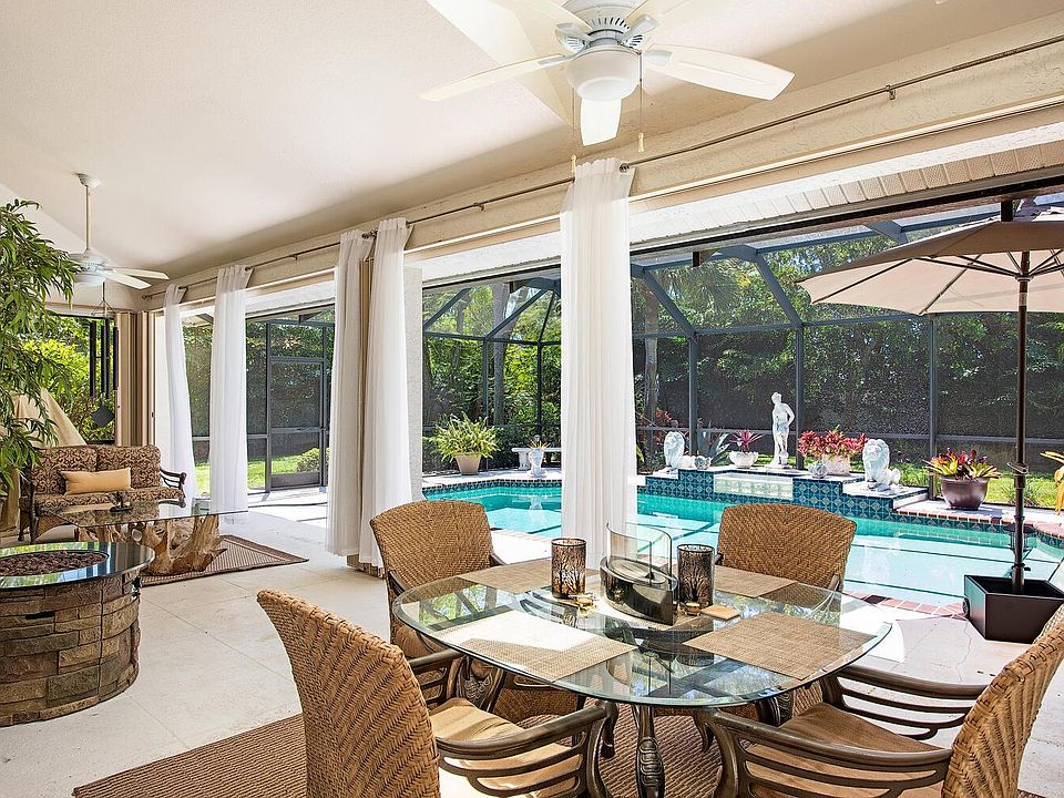 Oversized lanai has large heated "saltwater" pool, propane fire pit and grill, Cybex arc trainer, and plenty of seating for dining and lounging. Skylights and ceiling fans help ensure your comfort.