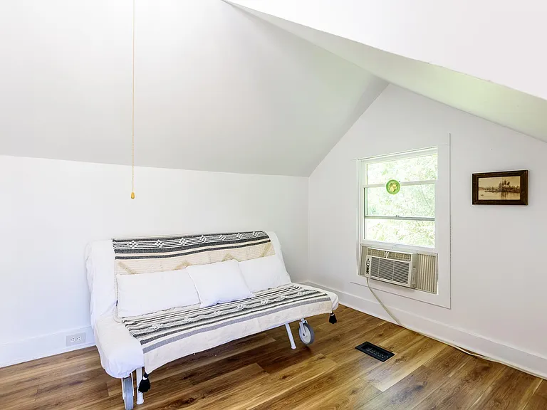 Sitting nook in bedroom with futon