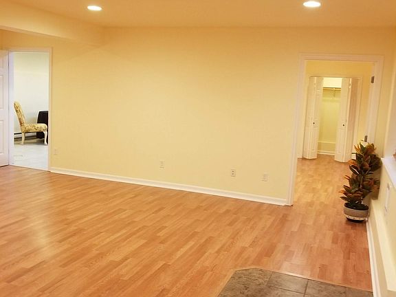 Living Room View 2 looking into Master Bedroom and Kitchen (left)