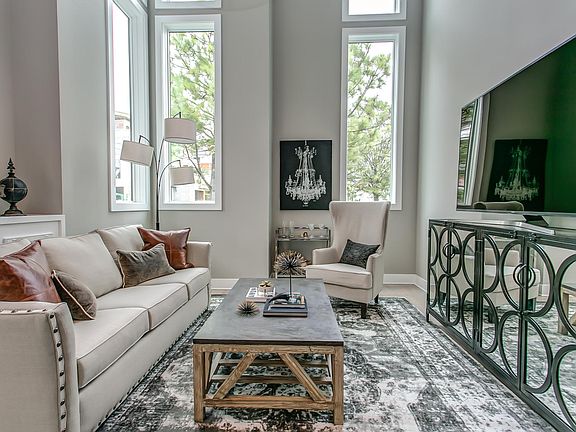 Living room with high ceilings and 70 inch TV