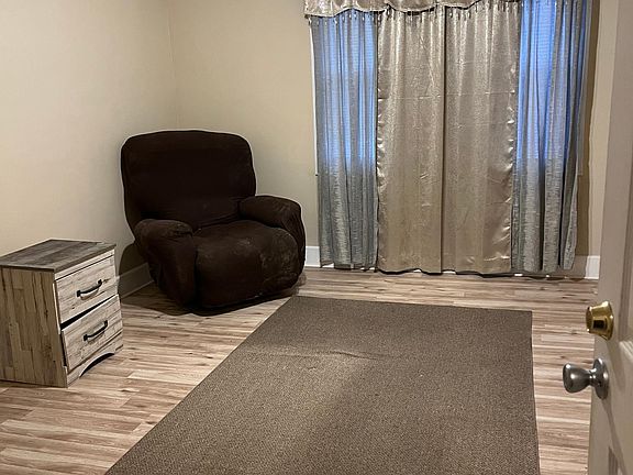 Master bedroom has new flooring and drapes