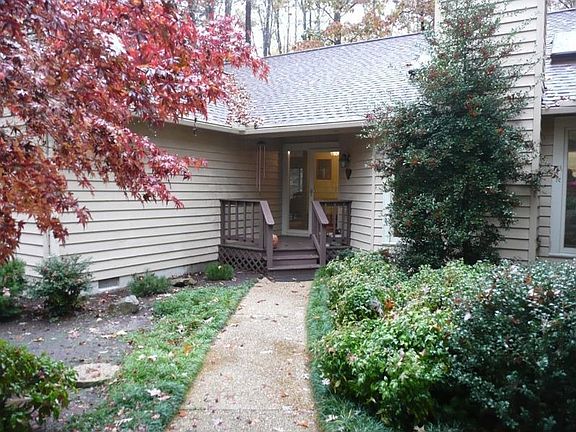 Welcome your guests in from this Beautiful Front Porch.  Aggregate Walk.