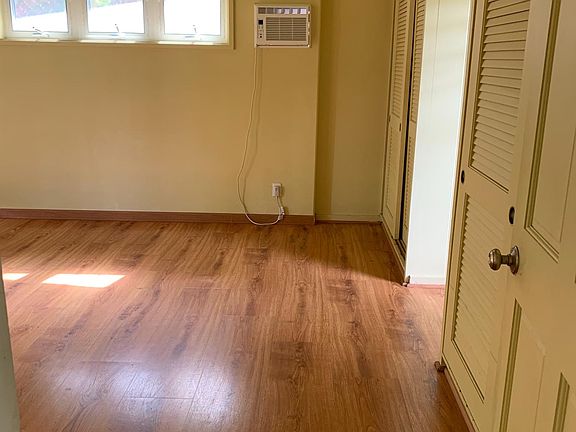 Looking into master bedroom with A/C. Plenty of natural light!