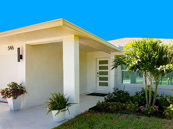 Covered entrance with Baldwin keyless entry and Ring doorbell.