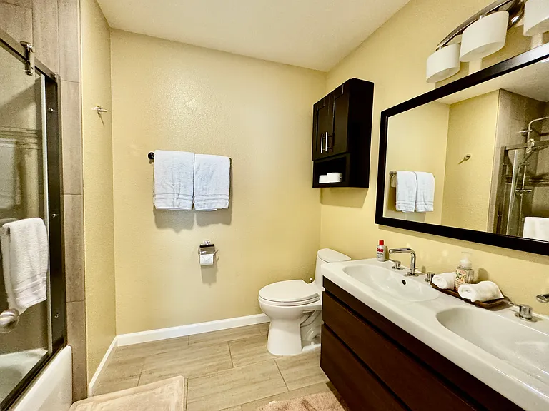 Spacious bathroom with Grohe fixtures and double sink in Master bedroom