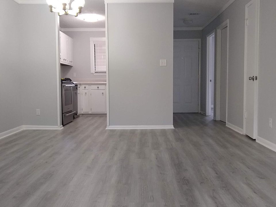 View from living room into kitchen. Bathroom #1 and both bedrooms are on your right.