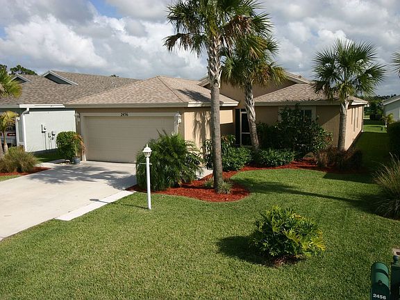 Front of Home #2 notice sidewalk on left side of home.  This leads to A/C.