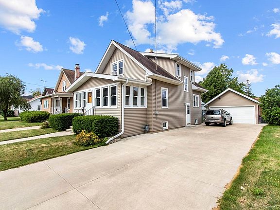 Newer concrete driveway with plenty of parking spaces!