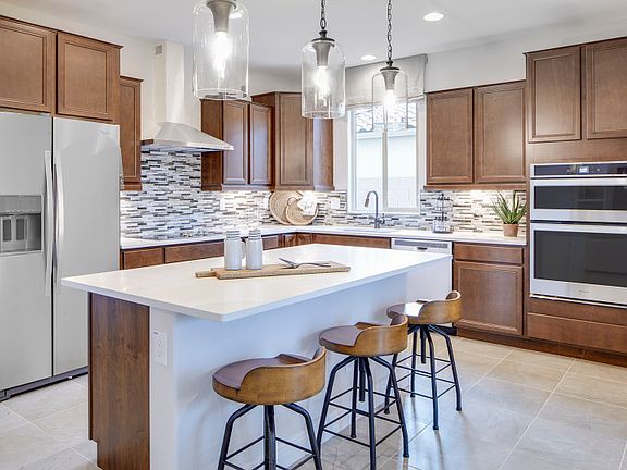 The Kitchen is Complete with a Large Pantry and Plenty of Overhead Lighting
