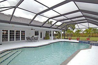 Screened Pool w/cool deck (solar heated) 