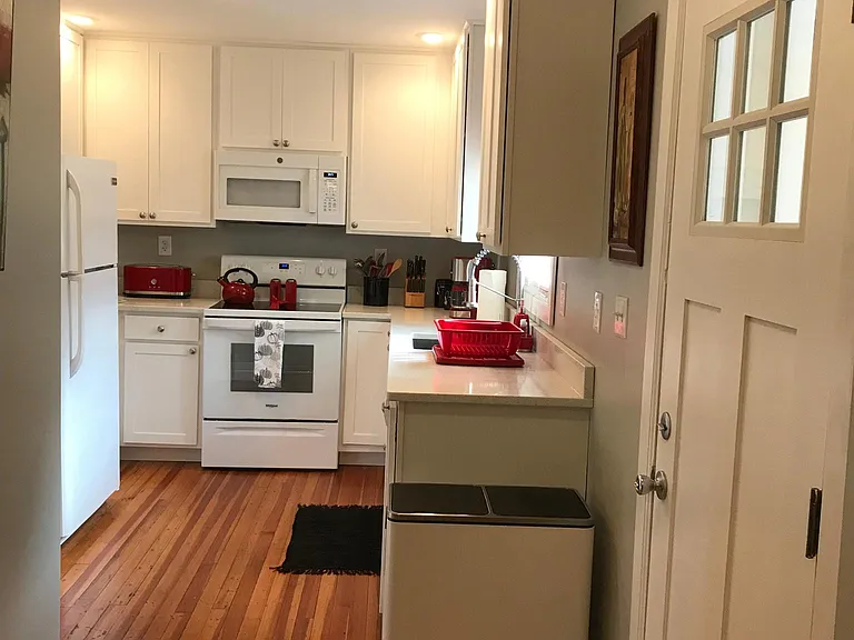 Cheerful kitchen with red small appliances