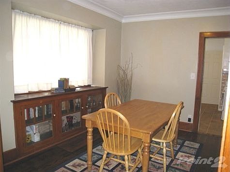 Formal dining area with build ins, wood floors