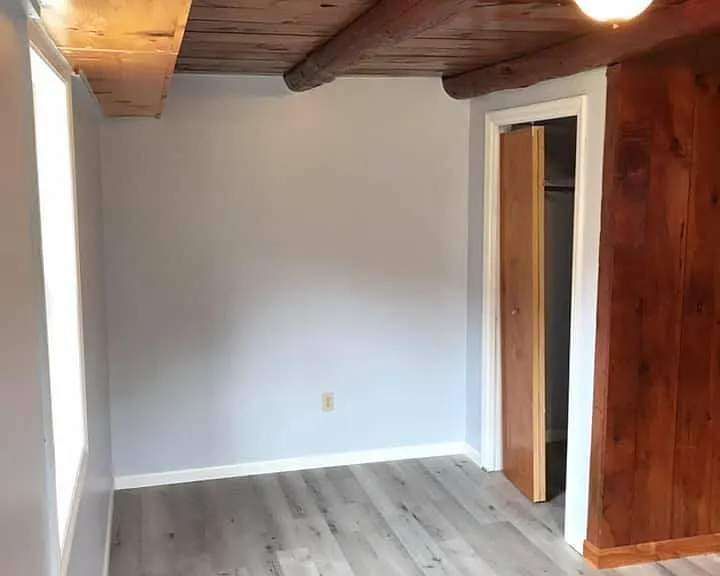 Larger bedroom looking towards closet.