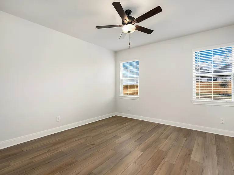 Master bedroom features vinyl flooring.