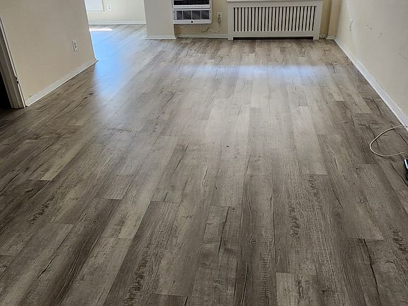 Open living area with new floors.