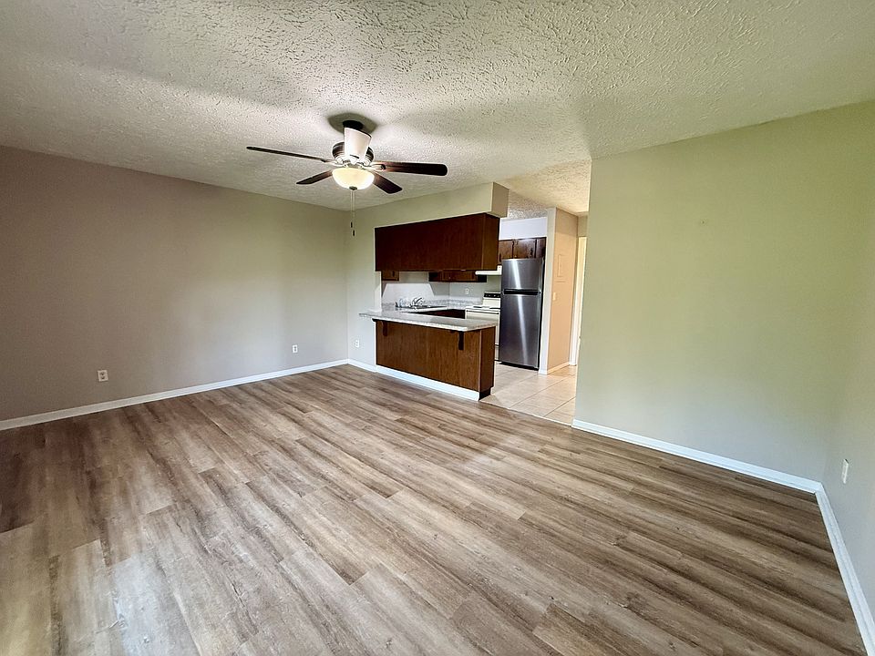 Open living area and kitchen with breakfast bar