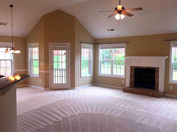 Open living room w/ access to patio