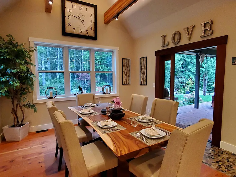 The Dining Room is conveniently located near the kitchen and accesses the covered deck with seating, hottub and a large concrete patio for campfires.