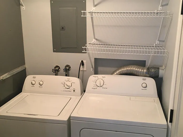Washer and dryer (provided) in laundry room, just off the kitchen and inside side entrance.