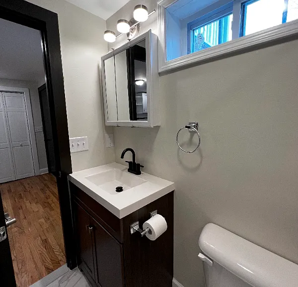 Updated bathroom with stone shower and window.