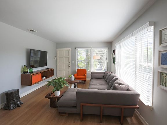 Living room. TVs are provided and house can come furnished.