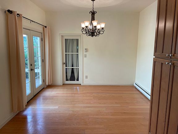 Dinning area, connected to the open kitchen with high ceilings adds a spaciousness to the room. At the end, a spacious walking pantry with shelving provides convenient storage. French doors open to the deck, patio and back yard