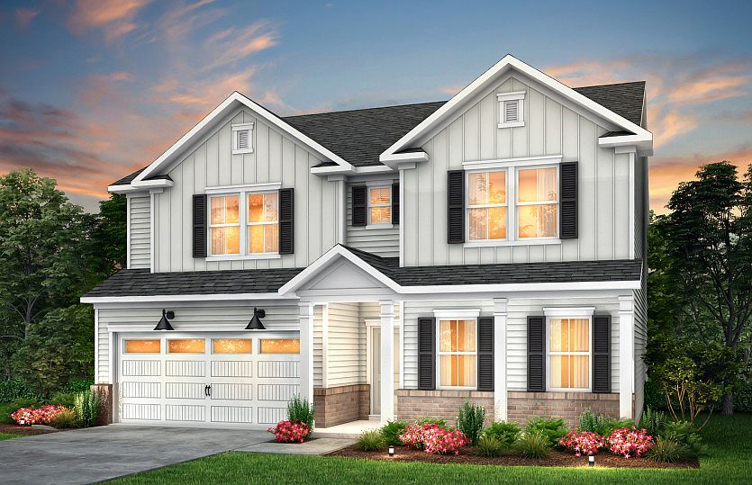 Mitchell Exterior LC2G features siding, brick, covered front siting porch and 2 car garage