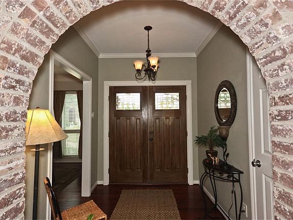 Entry is Warm and Welcoming, but offers privacy to the family room