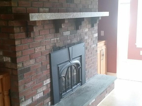 Fireplace with gas insert in Kitchen