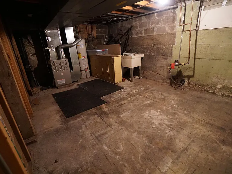 Additional storage area in unfinished basement