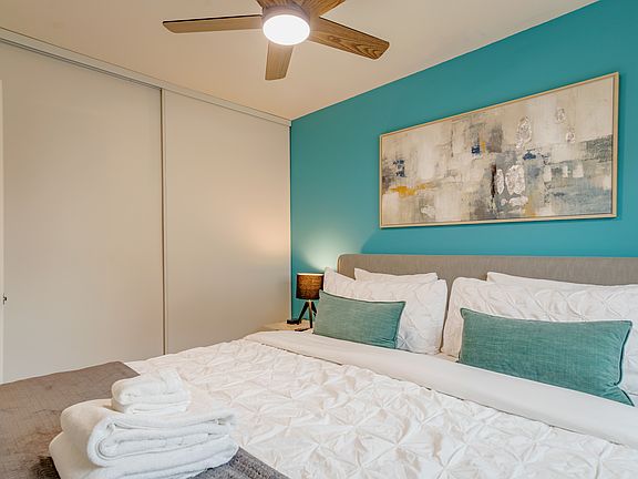 Cal King Bedroom with full closet with dresser.