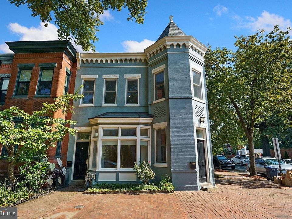 Imagine morning coffee in the turret! Come live in this darling historic home that served the neighborhood for decades as a grocery store.