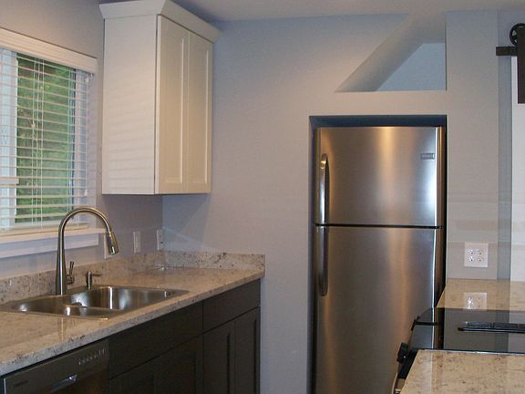 Open Floor Plan Combines Kitchen, Dining & Living Areas