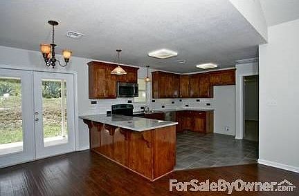 Great Room from Back
						:
						Many energy efficient windows for natural light throughout home
