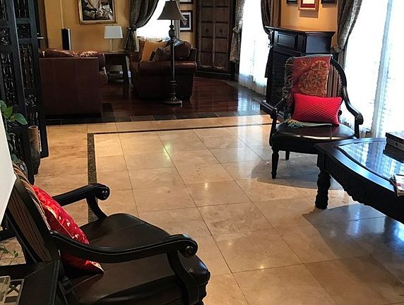 Entry with custom inlaid floors, recessed lighting