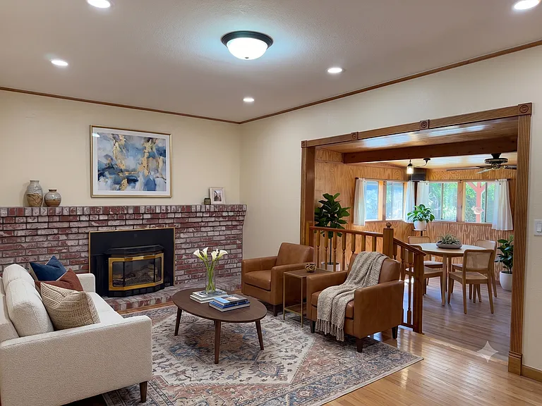 Brick fireplace with open flow into a windowed dining nook