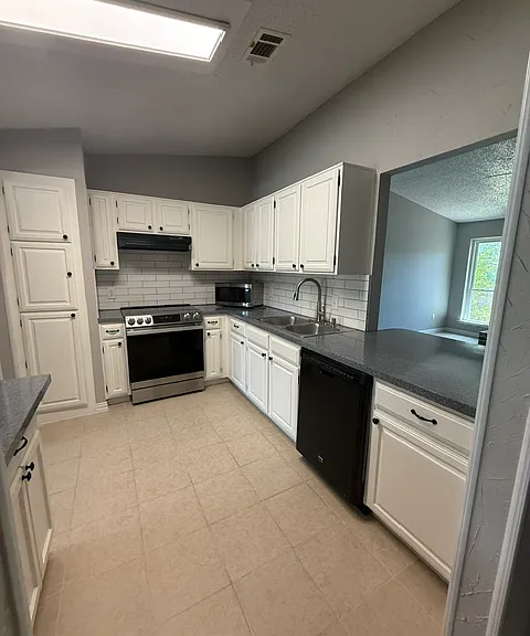 Kitchen that overlooks into Living Room