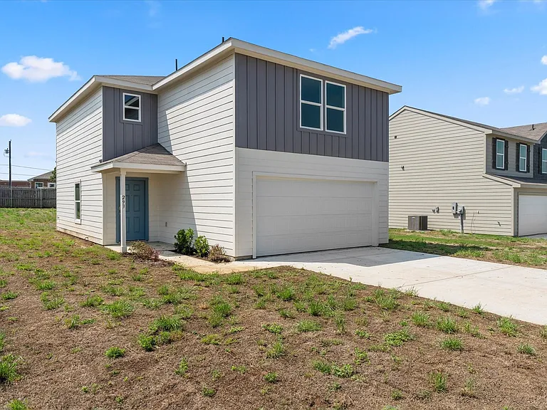 Two-story residence featuring light siding and darker board and batten accents