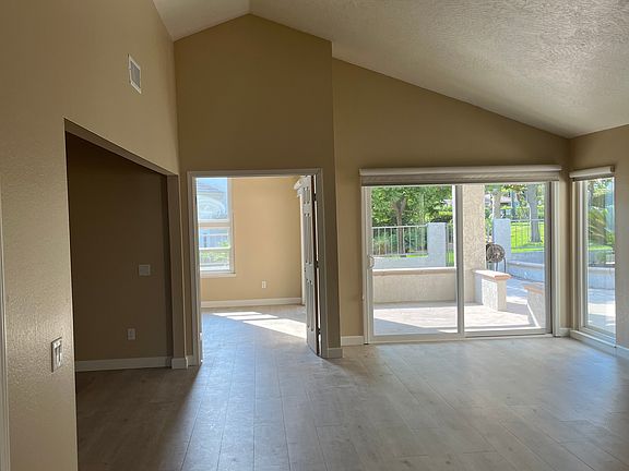 Living Room with vaulted ceilings and a gas fireplace