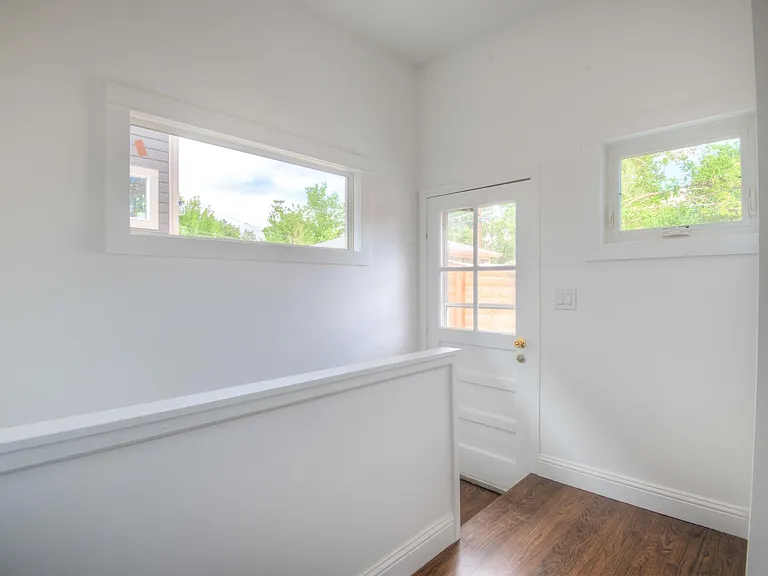 Door to backyard and staircase down to the basement.