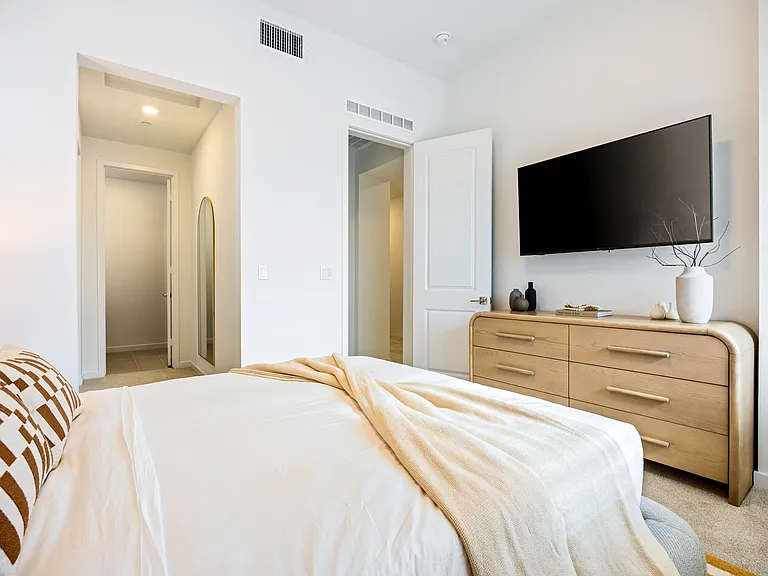 Guest room with its own TV and closet space.